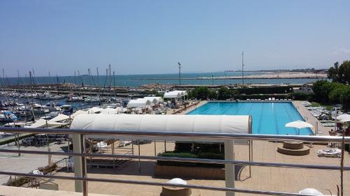 Club Nautico and bar view over pool out to sailing area. 2013 420 Worlds, Valencia, Spain © Rob Burn